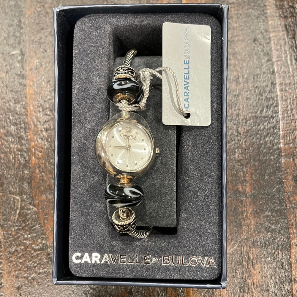 Caravelle by Bulova 43L141 Women's Round White Analog Black Beads Lacquer Watch
